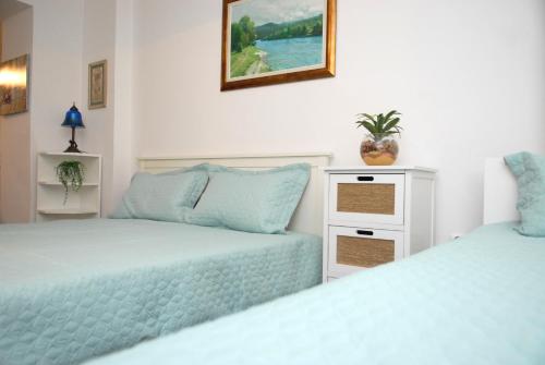 سرير أو أسرّة في غرفة في Apartment Dalia