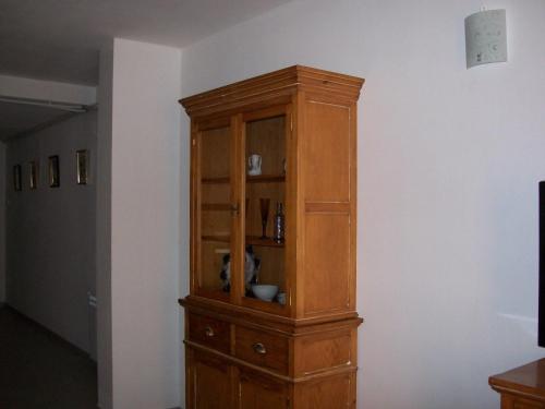 a wooden cabinet in the corner of a room at Apartments Luna 19 in Alcañiz