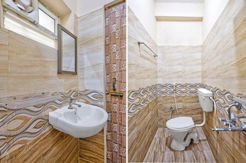 a bathroom with a toilet and a sink at Via KR in Chennai
