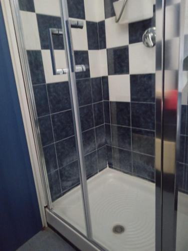 a shower with a glass door in a bathroom at Charme by the Sea, Sant'Andrea in SantʼAndrea Apostolo dello Ionio
