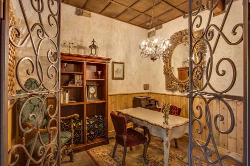 a dining room with a table and a mirror at Storybook Riverside Inn in Leavenworth