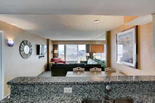 a large living room with a couch and a living room at Boardwalk Resort and Villas in Virginia Beach