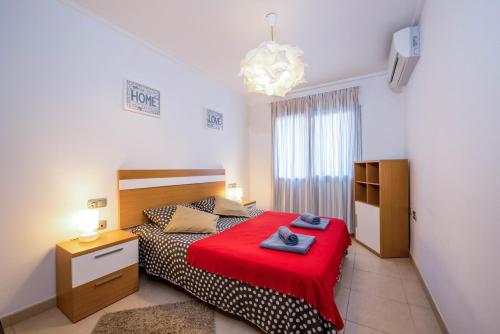 Ένα ή περισσότερα κρεβάτια σε δωμάτιο στο Alicante Apartments