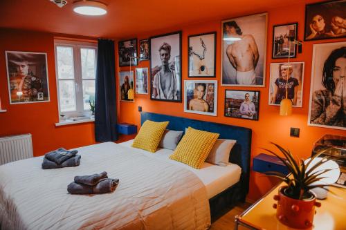 a bedroom with a bed with pictures on the wall at sleepArt music in Celle