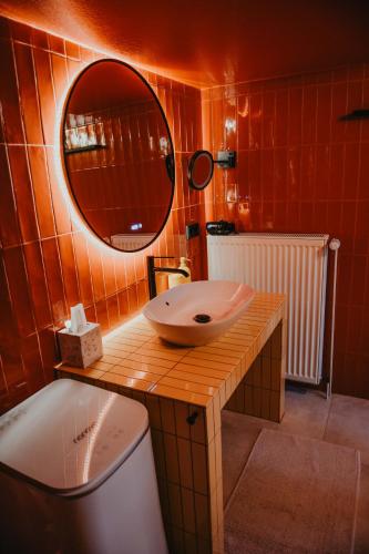 a bathroom with a sink and a mirror at sleepArt music in Celle
