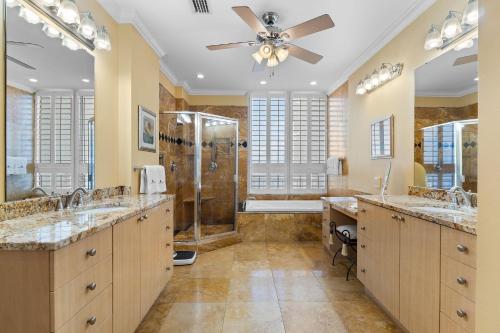 a bathroom with two sinks and a shower at La Playa 1001 in Perdido Key