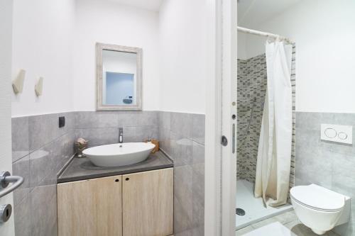 a bathroom with a sink and a toilet and a shower at Infinity Blue in Portovenere