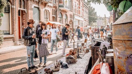a group of people walking down a street with shoes at Stijlvol 5P app met badkamer en suite en dakterras in Tilburg