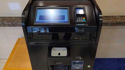 an atm machine with a computer on top of it at Toyoko Inn Fujisan Numazu eki Kita guchi No 1 in Numazu