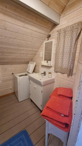 a bathroom with a sink and a toilet and a sink at Maisonnette à Saint Valéry Sur Somme in Saint-Valéry-sur-Somme