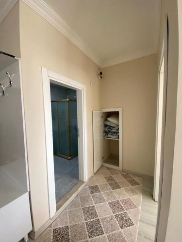 a room with a walk in closet and a hallway at Ada Mevan Otel in Ipekyolu