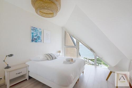 Llit o llits en una habitació de Le Minihic
