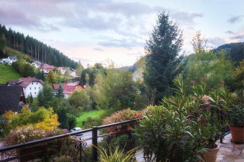 a view of a garden from a balcony at Alpenpension Gasthof in Ratten