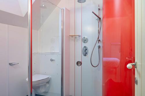 a bathroom with a shower and a toilet at Finest Retreats - Canal Central in Ball