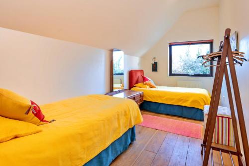 a bedroom with two beds and a ladder at Finest Retreats - Canal Central in Ball