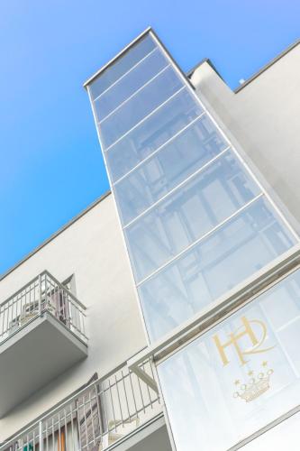 a facade of a building with a large window at Regina Hotel e Ristorante in Punta Marina