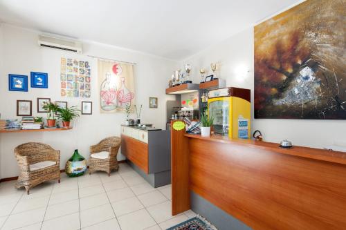 a room with a counter and aacistacistacistacistacist at Regina Hotel e Ristorante in Punta Marina