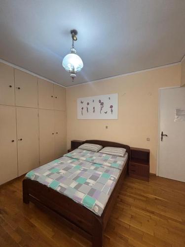 a bedroom with a large bed in a room at Imperial 5 in Athens