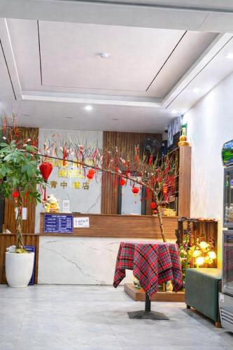 a store with a christmas tree in the middle of a room at Thành Trung Hotel Nghệ An in Vinh