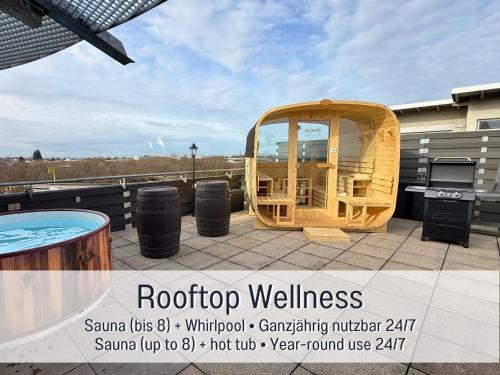 a hot tub on the roof of a building at Panorama Penthouse mit Dachterrasse - Sauna & Whirlpool in Karlsruhe