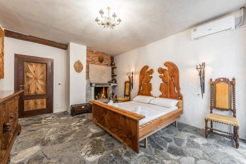 a large bathroom with a tub and a fireplace at Kanuni Authentic Albanian House by PikHost in Shkodër