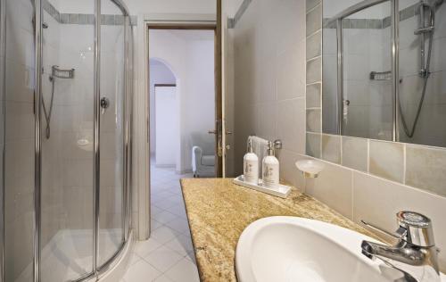 a bathroom with a sink and a shower at Resort Cala Di Falco in Cannigione