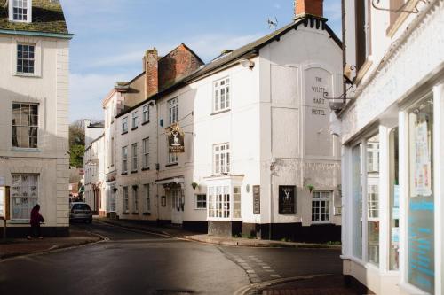 a street in a town with white buildings at The White Hart in Wiveliscombe