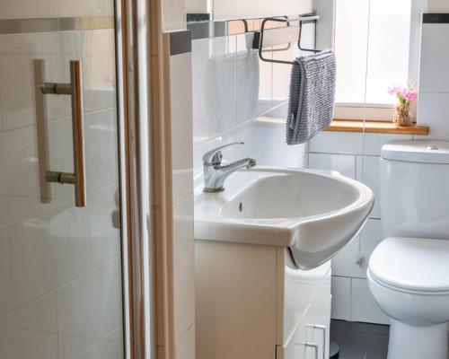 a bathroom with a sink and a toilet at Studio apartment next to Highgate tube station in London