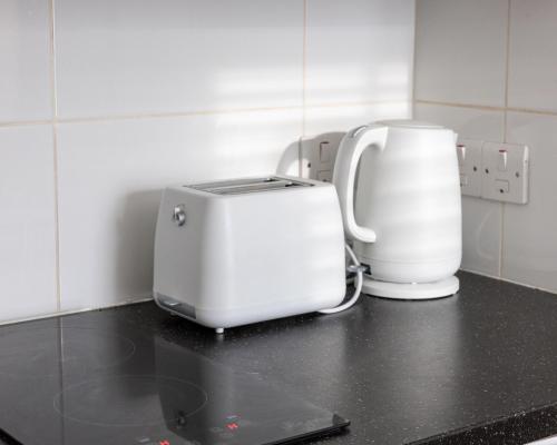a toaster and a blender sitting on a counter at Studio apartment next to Highgate tube station in London