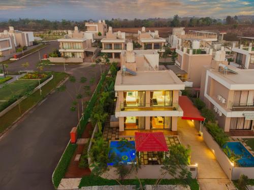 an aerial view of a city with houses at EKOSTAY - Trinity Villa in Karjat