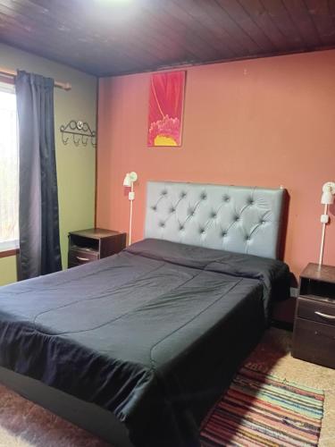 a bedroom with a large bed in a room at La Lugarda in Cuesta Blanca