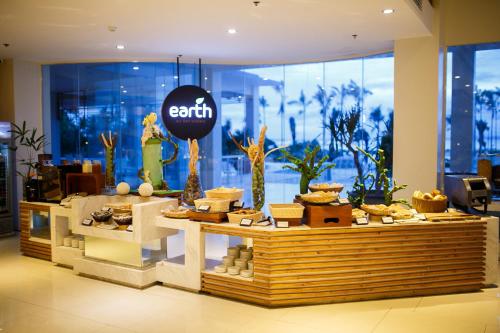 a store with a buffet of food on a table at Solea Mactan Resort in Mactan
