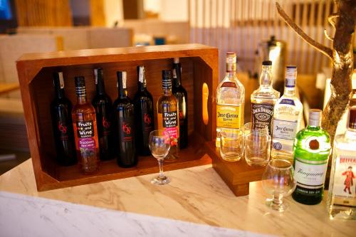 a wooden crate of wine bottles and glasses on a table at Solea Mactan Resort in Mactan