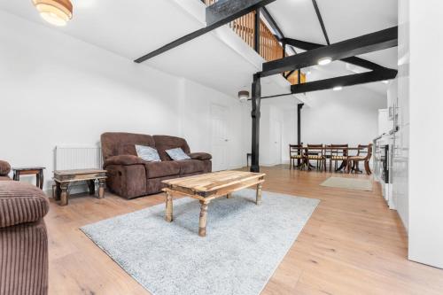 a living room with a couch and a coffee table at The Old Band Room House No 1 in Blaina