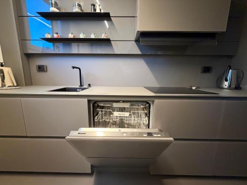 a kitchen with a dishwasher in the middle at Nuovo Fiore in Pesaro
