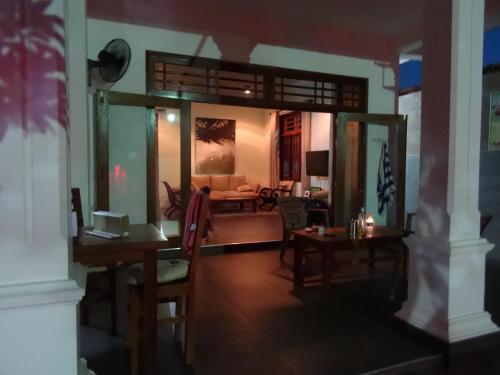 a living room with a couch and a table at Ok Cabana Negombo in Negombo