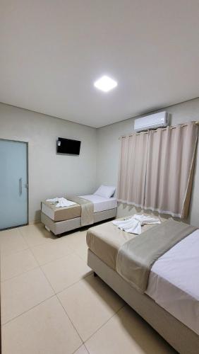 Lova arba lovos apgyvendinimo įstaigoje Hotel Trem de Minas 040