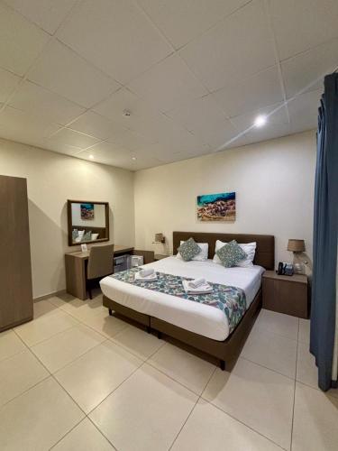 Llit o llits en una habitació de Hotel Kennedy Nova