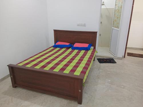 a bed with two pillows on it in a room at Jaya Rest house in Unawatuna