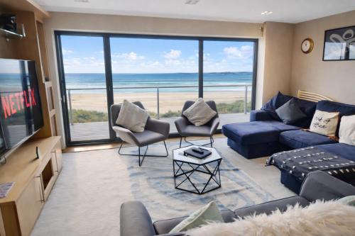 a living room with a view of the ocean at Stunning Swansea Marina beach house with sea views in Swansea