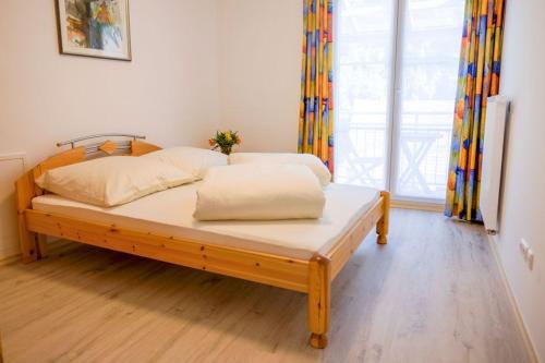 a bed with two pillows on it in a room at haus Plager in Landau an der Isar