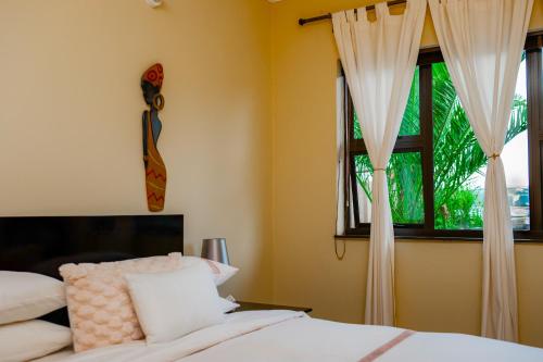 A bed or beds in a room at Infinity Home BnB