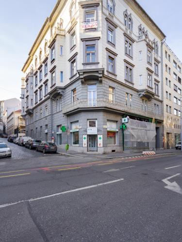 a large building on the corner of a street at Butik Apartments, by BQA in Budapest