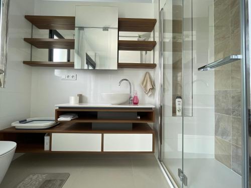 a bathroom with a sink and a shower at Sunny rest at Pedro's by PORT Holiday Rental in Arenales del Sol