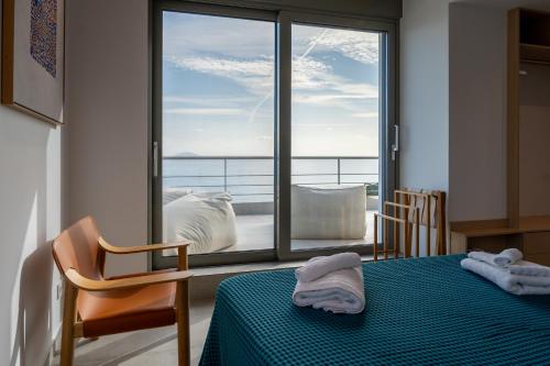 a room with a bed and a window with a view at Villa Rosemary in Xiropigado