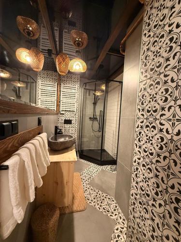 a bathroom with a shower and a sink at Leśna 6 in Sierakowo