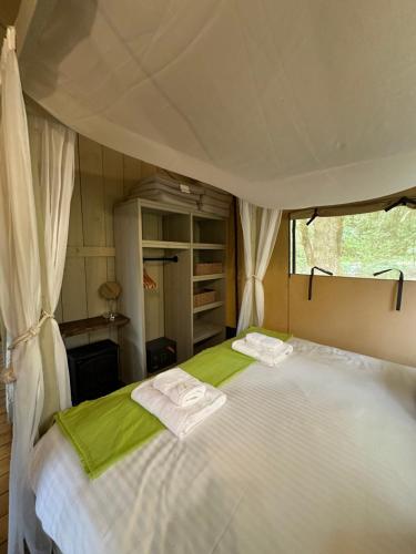 a bedroom with a bed in a tent at Blencathra - Safari Tent in Ambleside