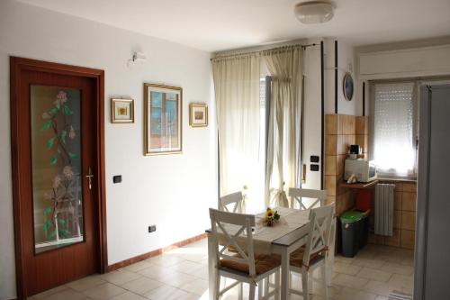 a kitchen with a table and chairs in a room at Situation House in Catanzaro Lido