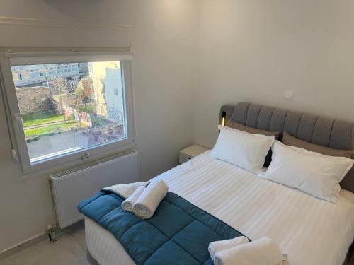 Llit o llits en una habitació de PHOENIX Luxury Suites