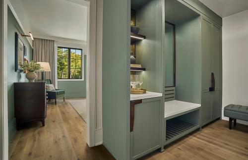 a room with a walk in closet with a desk at Pendry Natirar in Peapack